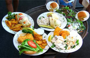 Several plates of food on a tray